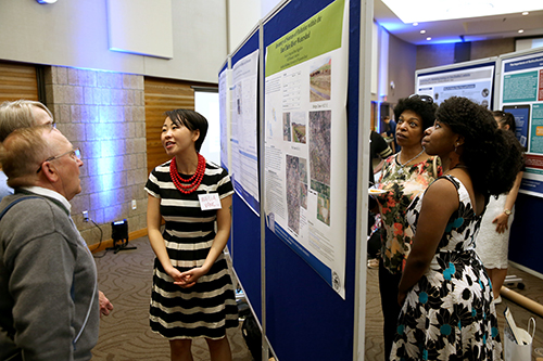 UW-Stout McNair Scholar Mai Lia Vang describes her research on “Urban Phosphorus Runoff and Loading to Half Moon Lake, Wisconsin” at the Memorial Student Center.