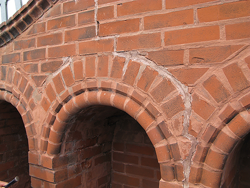 Brick and mortar damage on the tower can be seen near the clock.