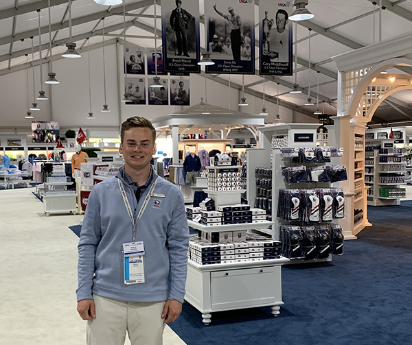 Sawyer Hrycay is an intern in the merchandise tent at the U.S. Open golf tournament, being held at Pebble Beach in California.