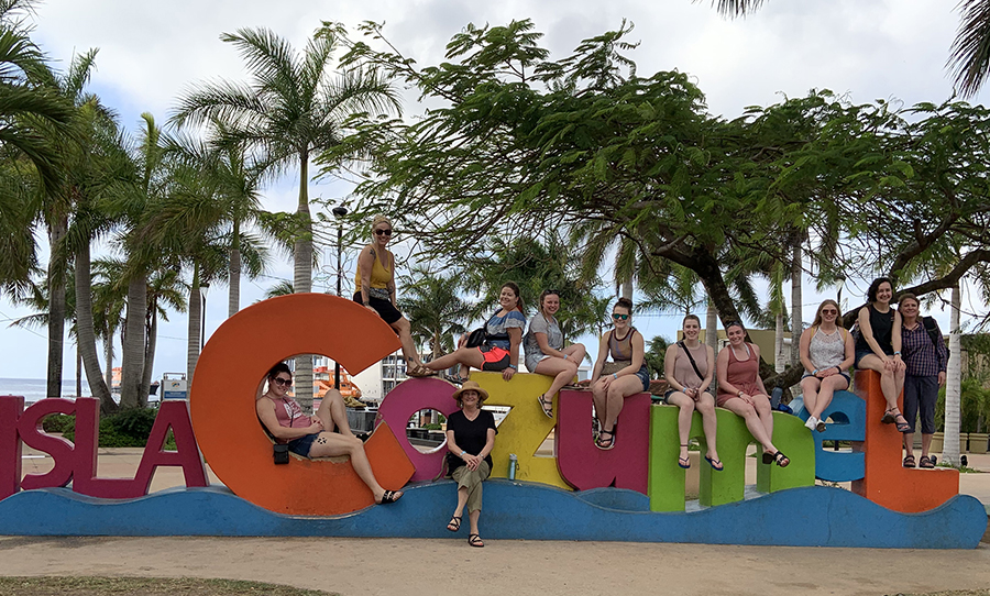 Nine UW-Stout students along with professors Terry Kohlmeier, third from left, and Ruth Nyland, right, went to Cozumel, Mexico, in January to volunteer in schools.
