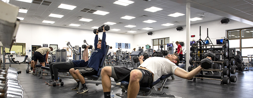 Students exercise in the fitness room