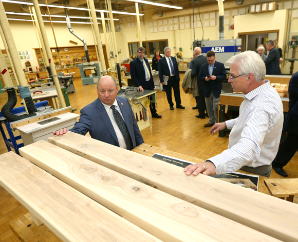 Ashley Furniture president and CEO Todd Wanek, left, tours the woods lab in Jarvis Hall Technology Wing with Professor Jerry Johnson Thursday, Oct. 26, during the Cabot Executive in Residence program.