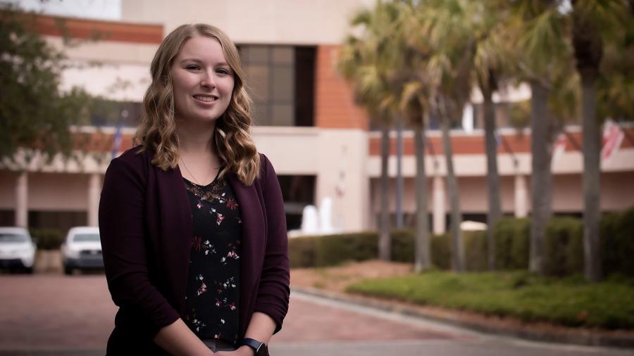 Nikki Ruf, a 2020 UW-Stout graduate, stands outside the the Naval Information Warfare Center in Charleston, S.C., where she is an IT specialist and project manager.