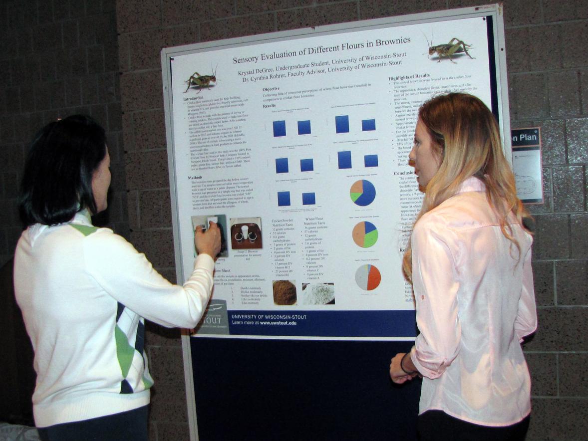 Krystal Degree, right, and Eun Joo Lee, food and nutrition department chair, discuss DeGree’s research on flour made from crickets.