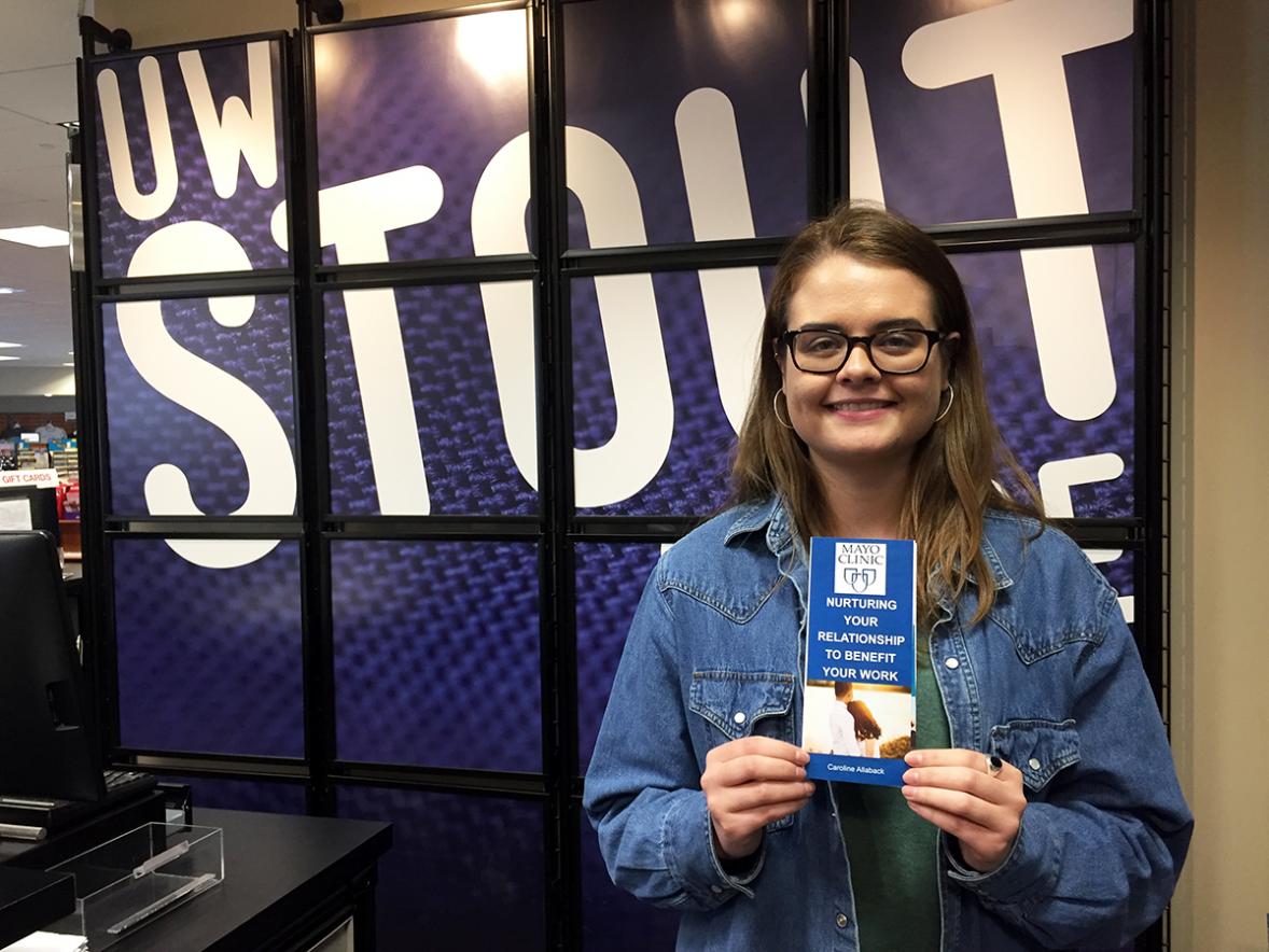 UW-Stout student Carolyn Allaback has created a brochure that Mayo Clinic plans to make available for its 60,000 employees nationwide to remind them about the importance of nurturing health relationships. / UW-Stout photo by Pam Powers