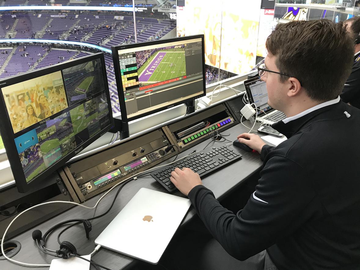 Connor Clark works in the U.S. Bank Stadium broadcast room. Clark collects footage and creates videos or adds graphics to footage for in-stadium fans at home Minnesota Vikings games.