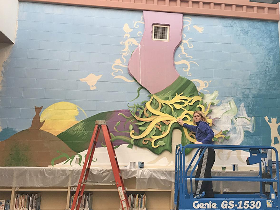 Tami Weiss works on the Oaklawn Elementary mural