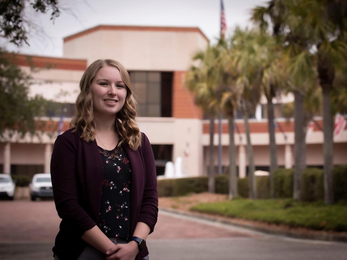 Nikki Ruf, a 2020 UW-Stout graduate, stands outside the the Naval Information Warfare Center in Charleston, S.C., where she is an IT specialist and project manager.