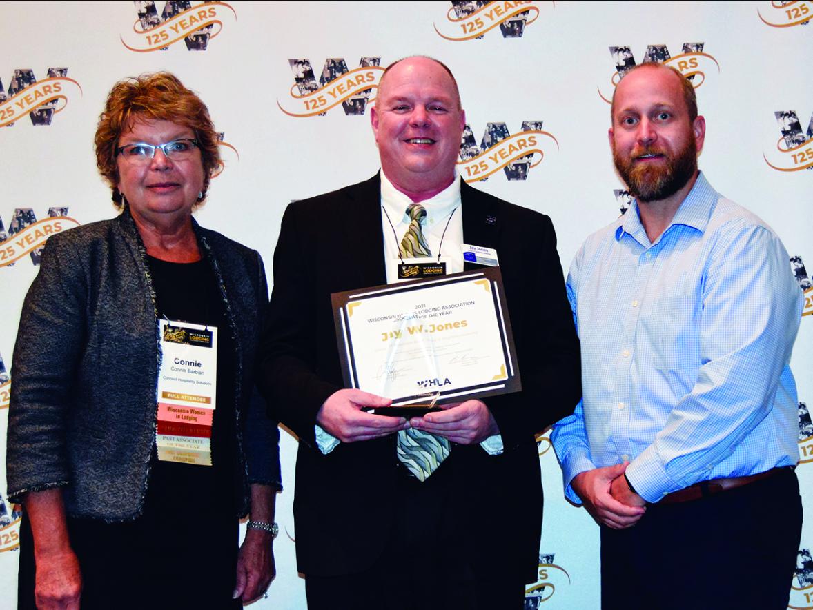 Jay Jones, center, from UW-Stout receives the 2021 Associate of the Year award from the Wisconsin Hotel & Lodging Association. At left is Connie Barbian, of Connect Hospitality Solutions, the 2021 winner. At right is Charlie Eggen, of F&E Hospitality, the 2021 WHLA chairman of the board.