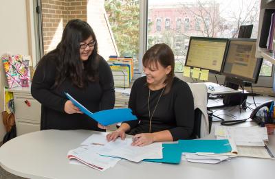 Joua Lor and Erin Dunbar work within the Human Resources office.