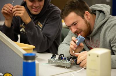 Technology education students in a Mechatronics course